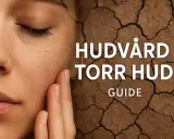 Närbild på en ansikte med torr hud, som liknar sprickor i torr jord. Texten "HUDVÅRD TORR HUD GUIDE" syns.