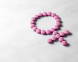 Rosa piller formar kvinnosymbolen. Kan symbolisera hormonbehandling, eller att urin luktar illa klimakteriet.