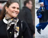 Kronprinsessan Victoria visar hur man snyggt kan knyta scarf runt halsen, matchat med en elegant svart kofta.